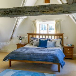 country bedroom with blue bed linen