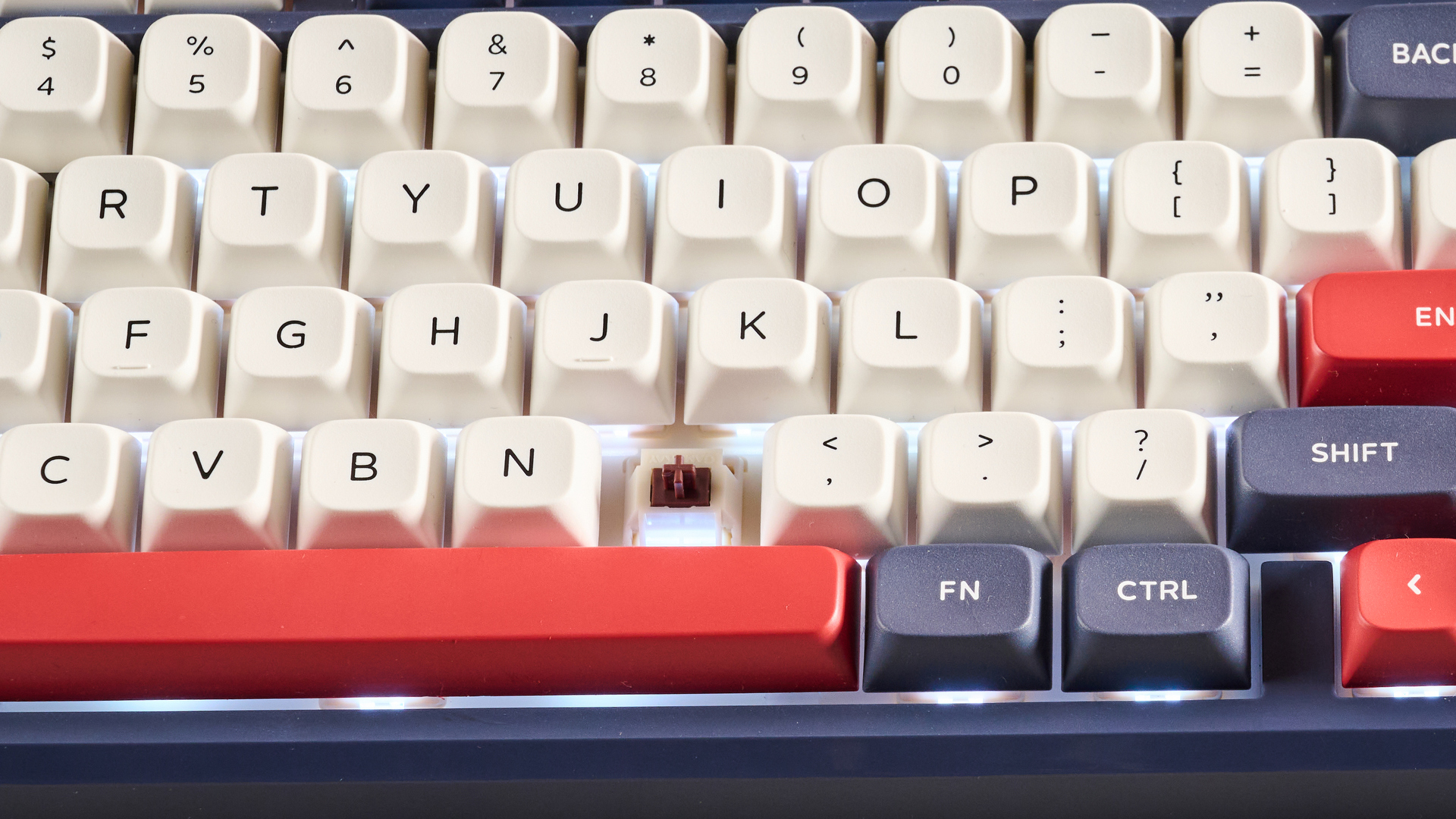 Close-up of keys on Gamakay TK101, missing a key, exposing the switch below