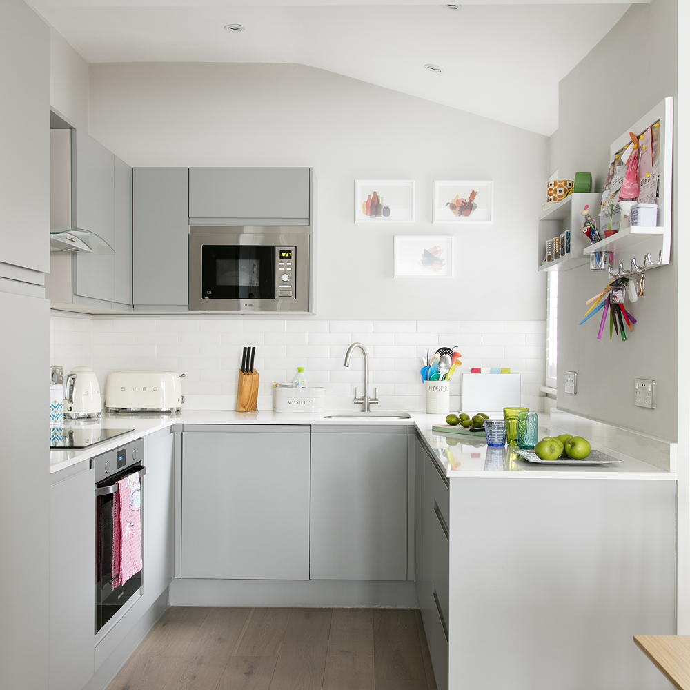 kitchen with white cabinet and wooden flooring