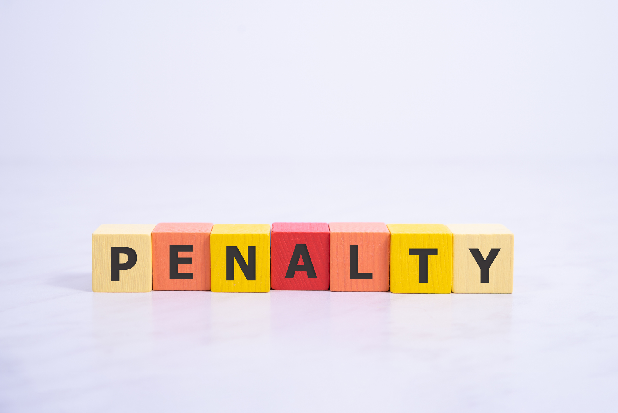 PENALTY word made with building blocks, payment concept.