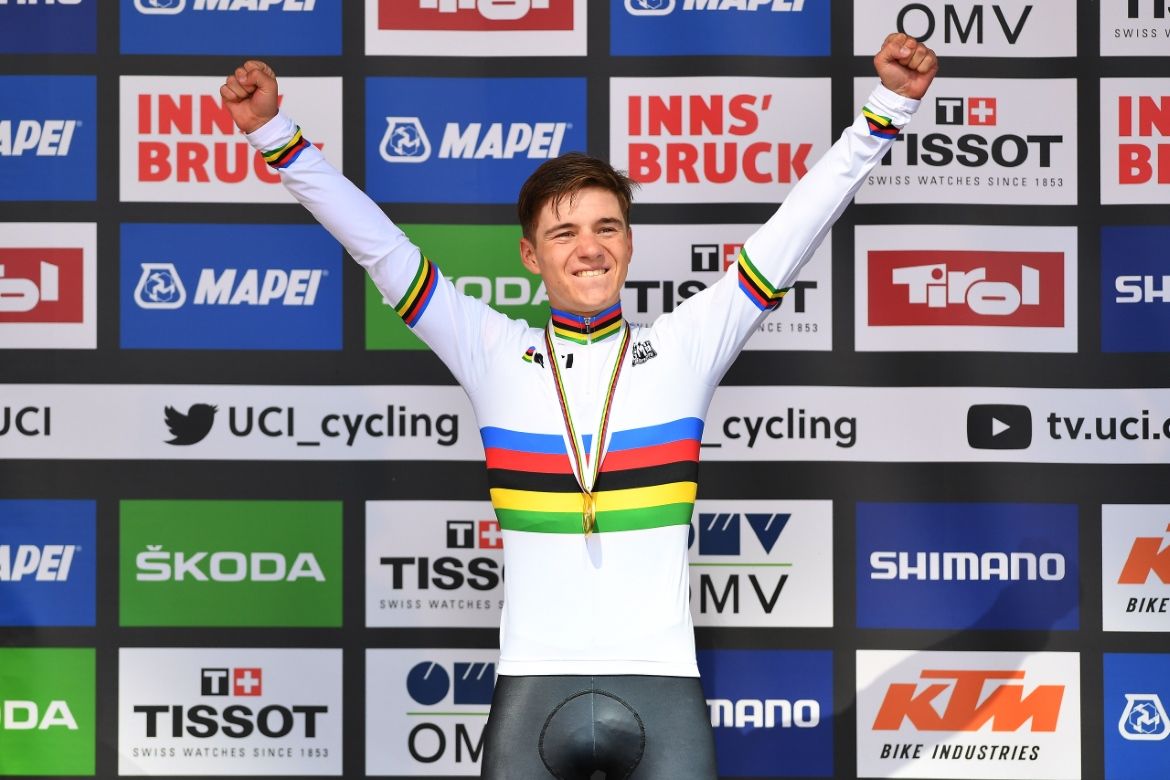 Remco Evenepoel celebrates on the podium