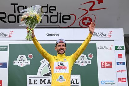 Adam Yates celebrates his Romandie victory in Geneva