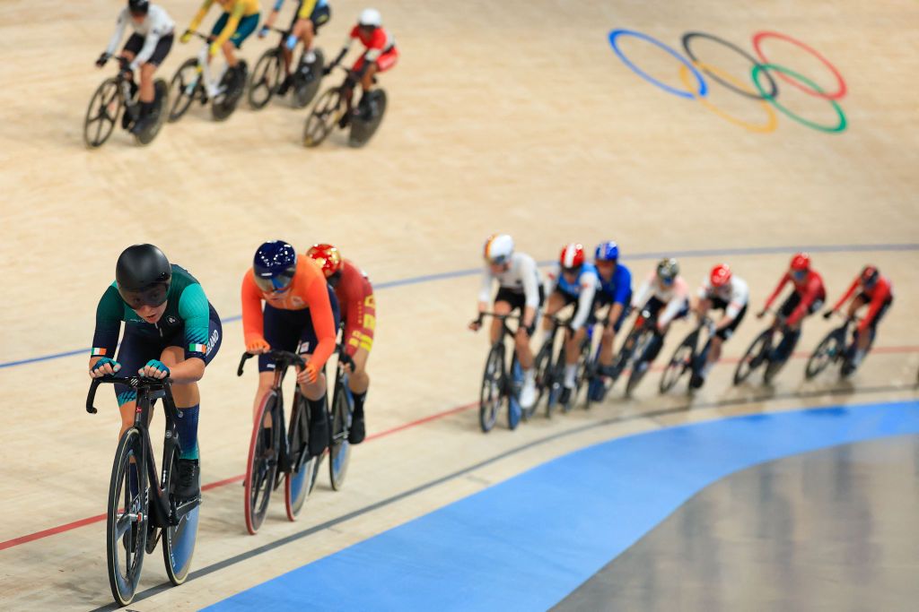 Ireland's Lara Gillespie leads riders in the women's track cycling omnium points race of the Paris 2024 Olympic Games at the Saint-Quentin-en-Yvelines National Velodrome in Montigny-le-Bretonneux, south-west of Paris, on August 11, 2024. (Photo by Emmanuel DUNAND / AFP)