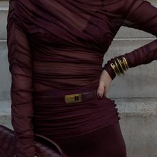 @hannahstraffordtaylor outfit closeup in burgundy with matching saint laurent belt and bottega veneta clutch