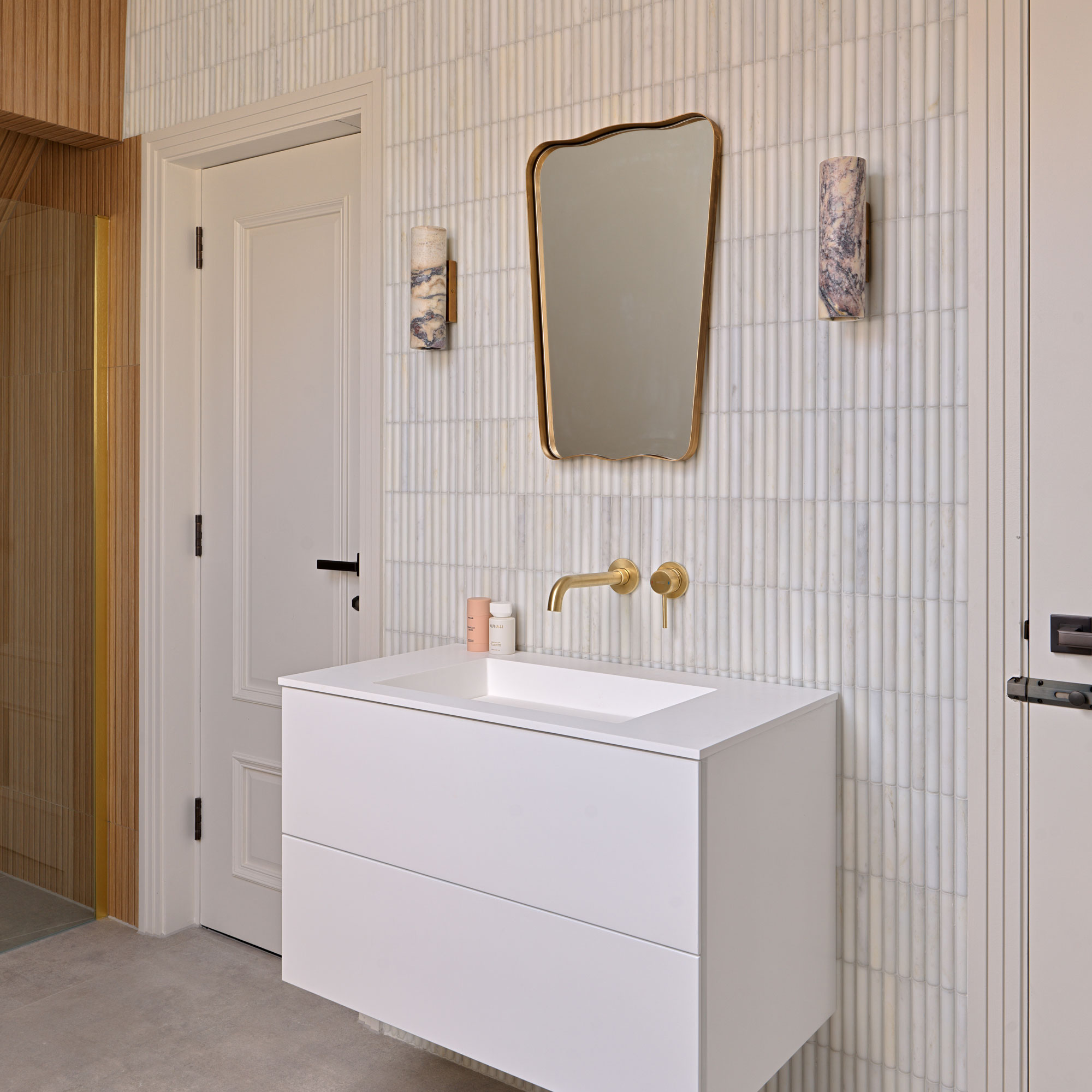 White bathroom with wood clad shower, bamboo tiles and white vanity
