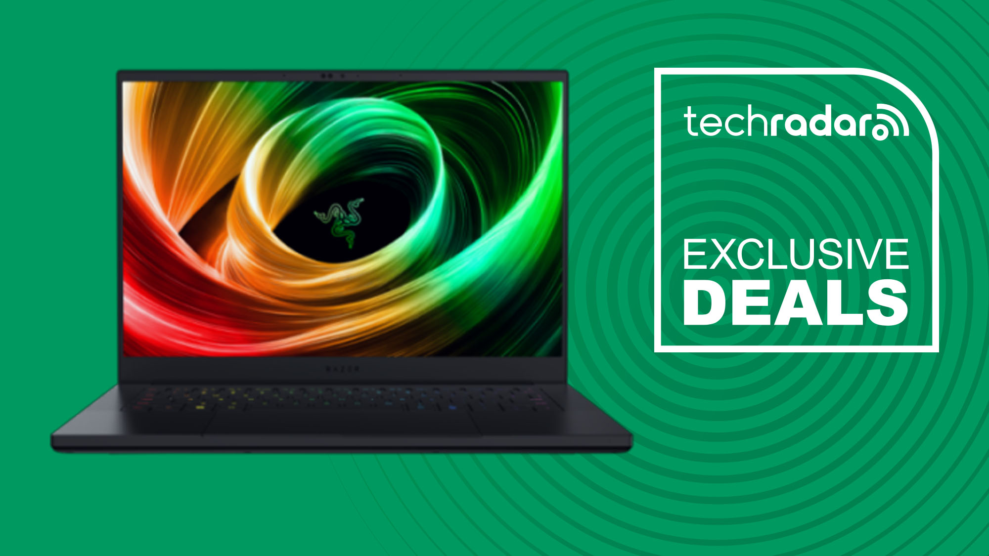 A Razer Blade 14 against a green TechRadar background