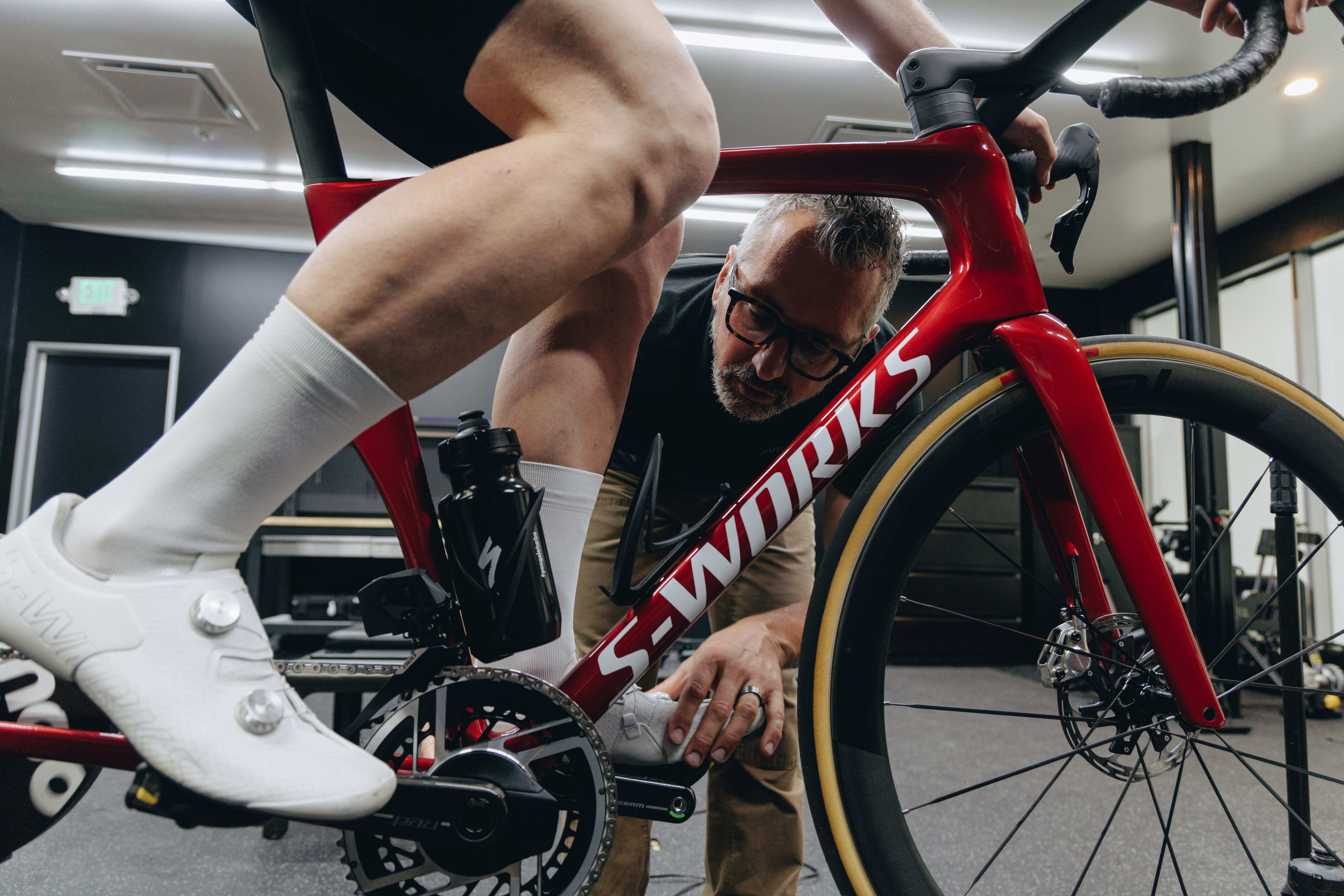 Jason Williams giving a bike fit to Josh Croxton