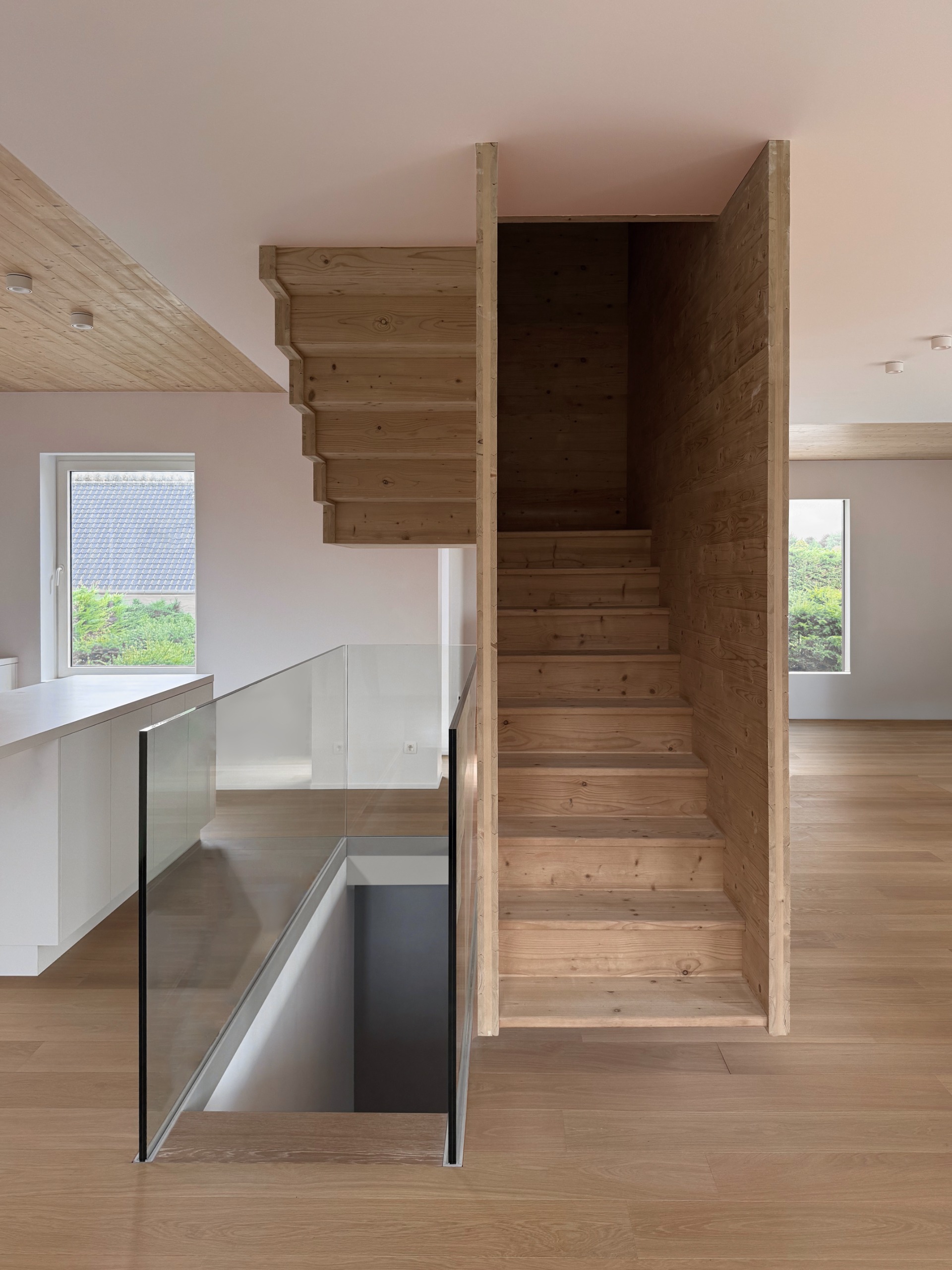 The staircase sits in the heart of the living area on the ground floor