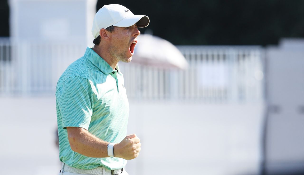 Rory fist pumps after holing a putt