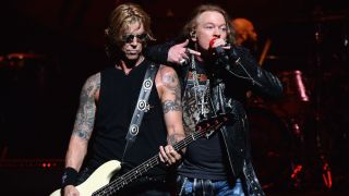 Duff McKagan (L) and Axl Rose of Guns N' Roses perform onstage during SiriusXM's Private Show with Guns N' Roses at The Apollo Theater before band embarks on next leg of its North American 'Not In This Lifetime' Tour on July 20, 2017 in New York City.