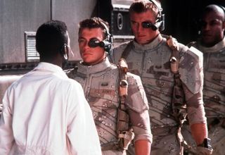 Universal Soldier - Dolph Lungrenâ€™s state-of-the-art cyborg soldier looms over co-star Jean-Claude Van Damme.