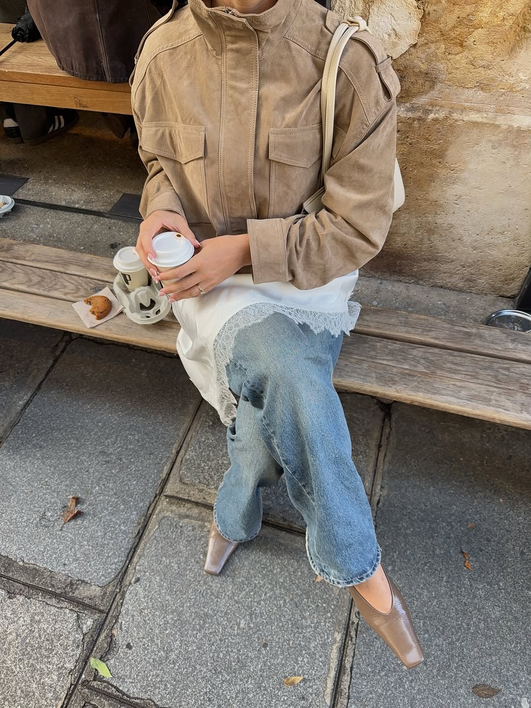 woman wearing winter to spring transitional capsule wardrobe 2026