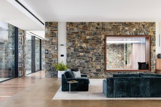 The main living space, with high ceilings and expansive glazing at Tinderbox House by Studio Ilk Architecture