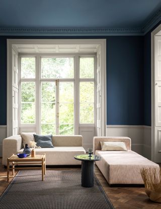 Navy blue living room with white border