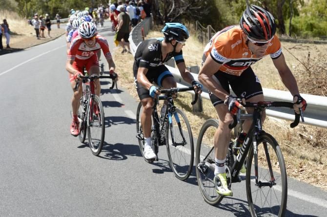 Cadel Evans and Richie Porte lead a reduced peloton up Willunga Hill for one final time