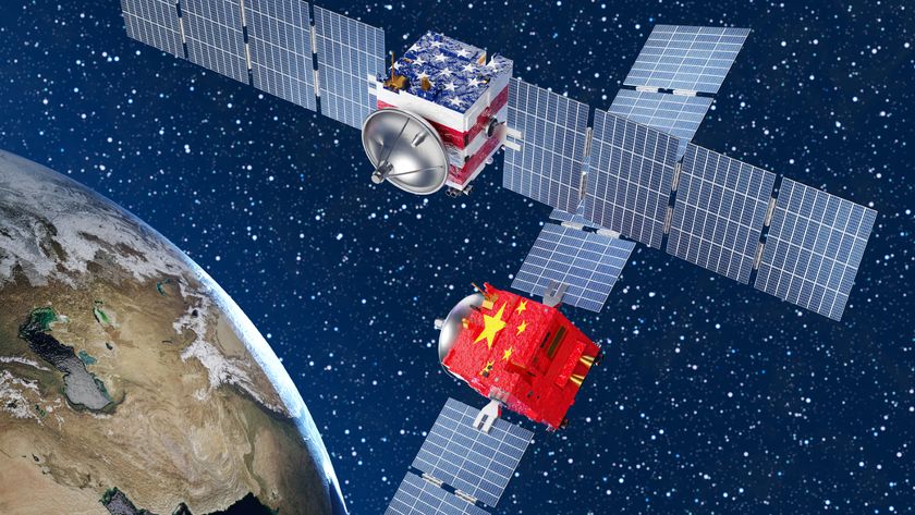 Two satellites with solar panels on either side, one with a USA flag and one with a Chinese flag, hover above Earth in this illustration