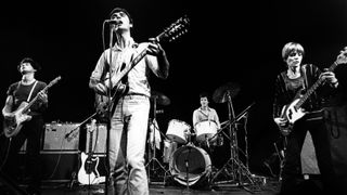 Talking Heads perform on stage at The Roundhouse, Chalk Farm, London, 29th January 1978. L-R Jerry Harrison, David Byrne, Chris Franz, Tina Weymouth. David Byrne is playing a Gibson ES-335 12 string electric guitar.
