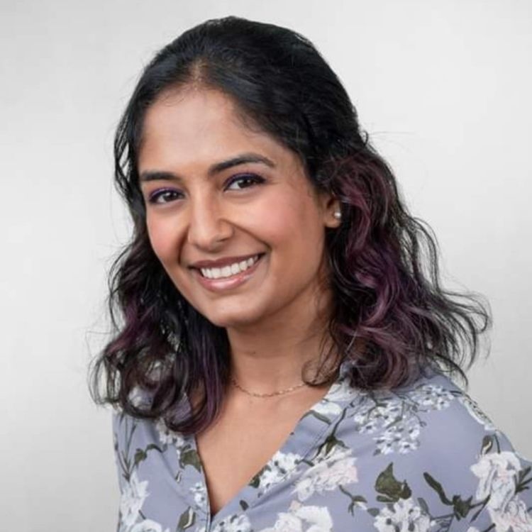 A woman smiles in a headshot