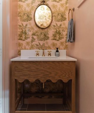 Pink bathroom with floral wallpaper