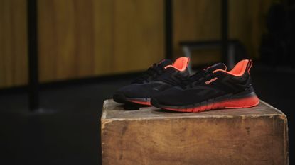 The Reebok Nano Gym shoe on a plyo box