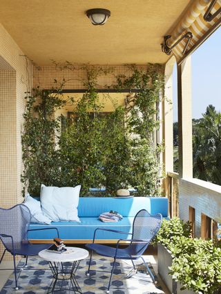 outdoor deck with sky blue sofa