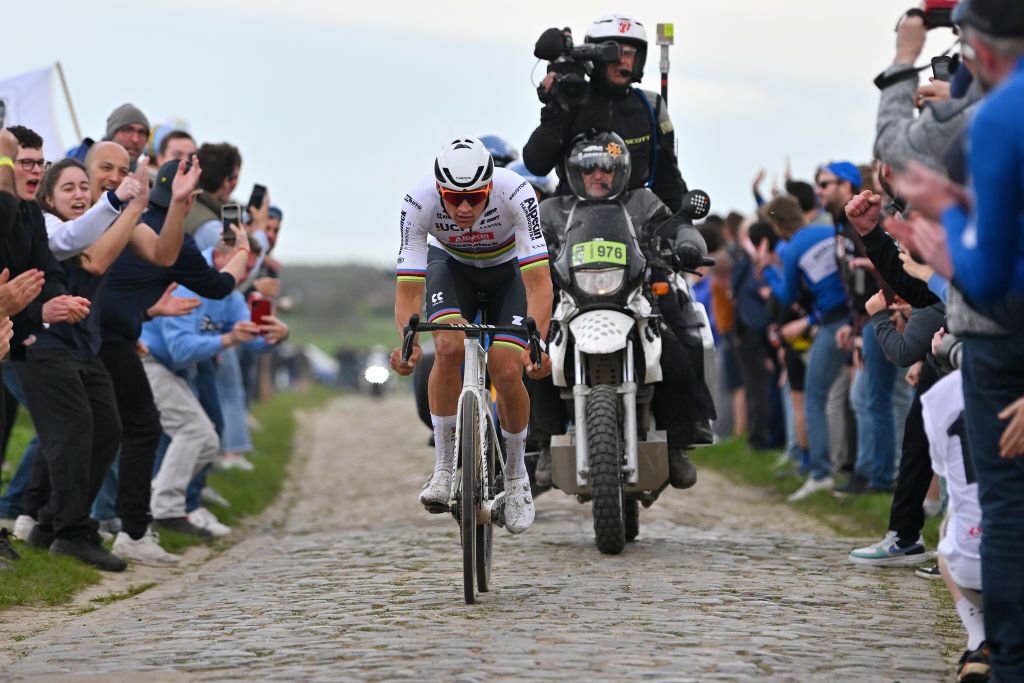 ROUBAIX FRANCE APRIL 07 Mathieu van der Poel of The Netherlands and Team Alpecin Deceuninck competes in the breakaway passing through the MonsenPvle cobblestones sector while fans cheer during the 121st ParisRoubaix 2024 a 2597km one day race from Compiegne to Roubaix UCIWT on April 07 2024 in Roubaix France Photo by Luc ClaessenGetty Images