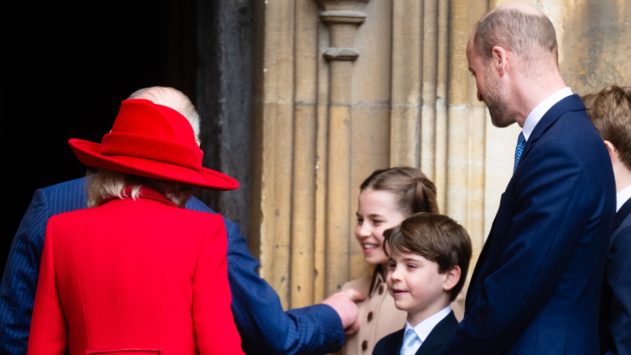 King Charles III and Queen Camilla greet Princess Charlotte, Prince Louis and Prince William, Prince of Wales as they attend the 2026 Easter Matins Service at St George's Chapel on April 05, 2026