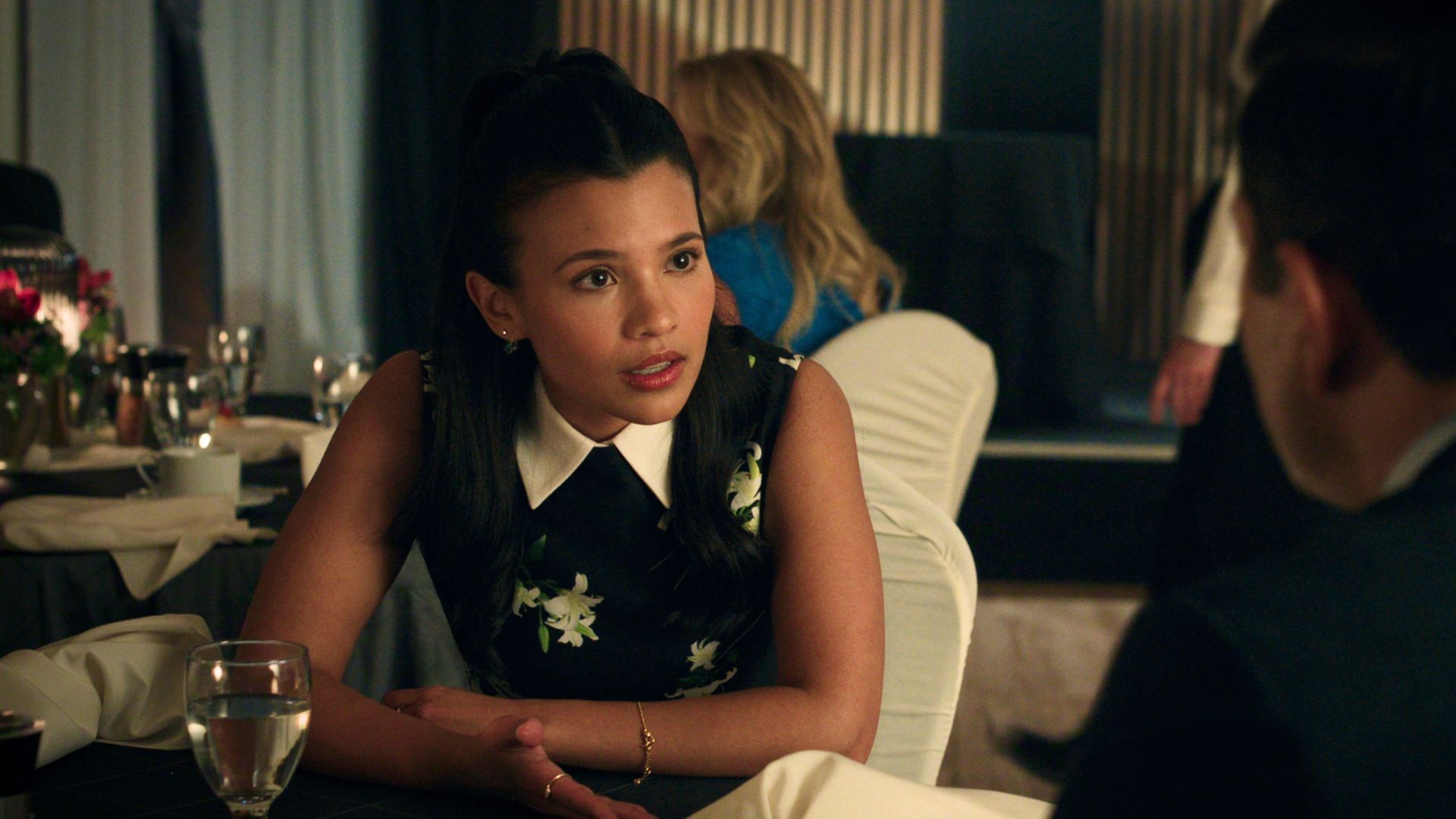 Jackie talks to Eliot across a restaurant table