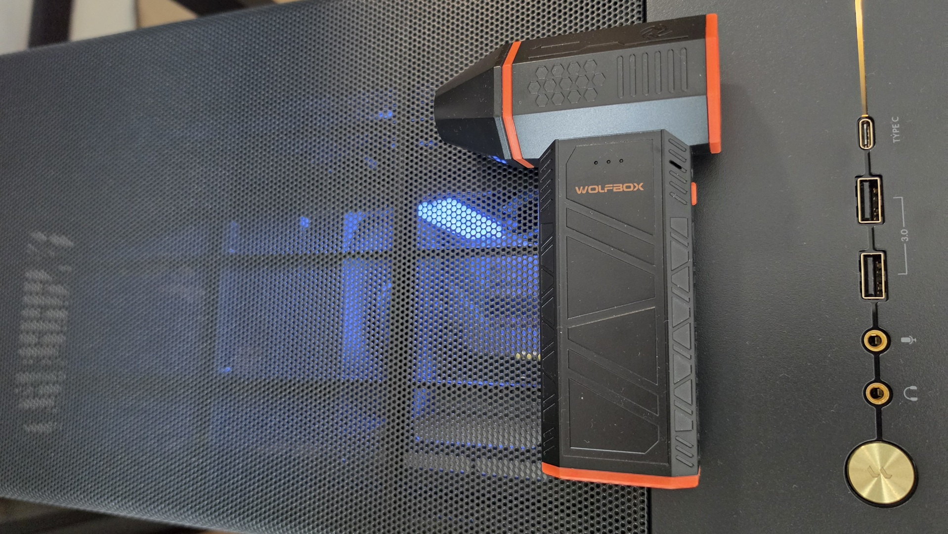 Wolfbox MF50 Electric Air Duster on top on a Fractal Design North PC case