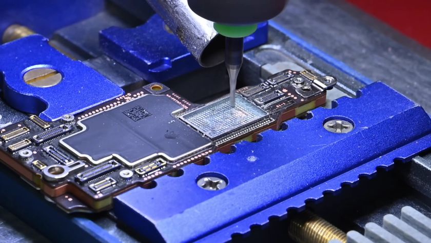 A screenshot from a video by DirectorFeng on YouTube, showing the use of a CNC mill to remove the SSD module from an iPhone 17 Pro Max SOC.