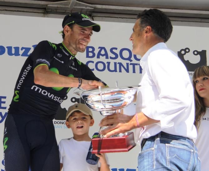 Alejandro Valverde is presented with the trophy for the winner of Clasica San Sebastian