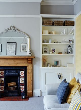 Original cast-iron fireplace with decorative tiles