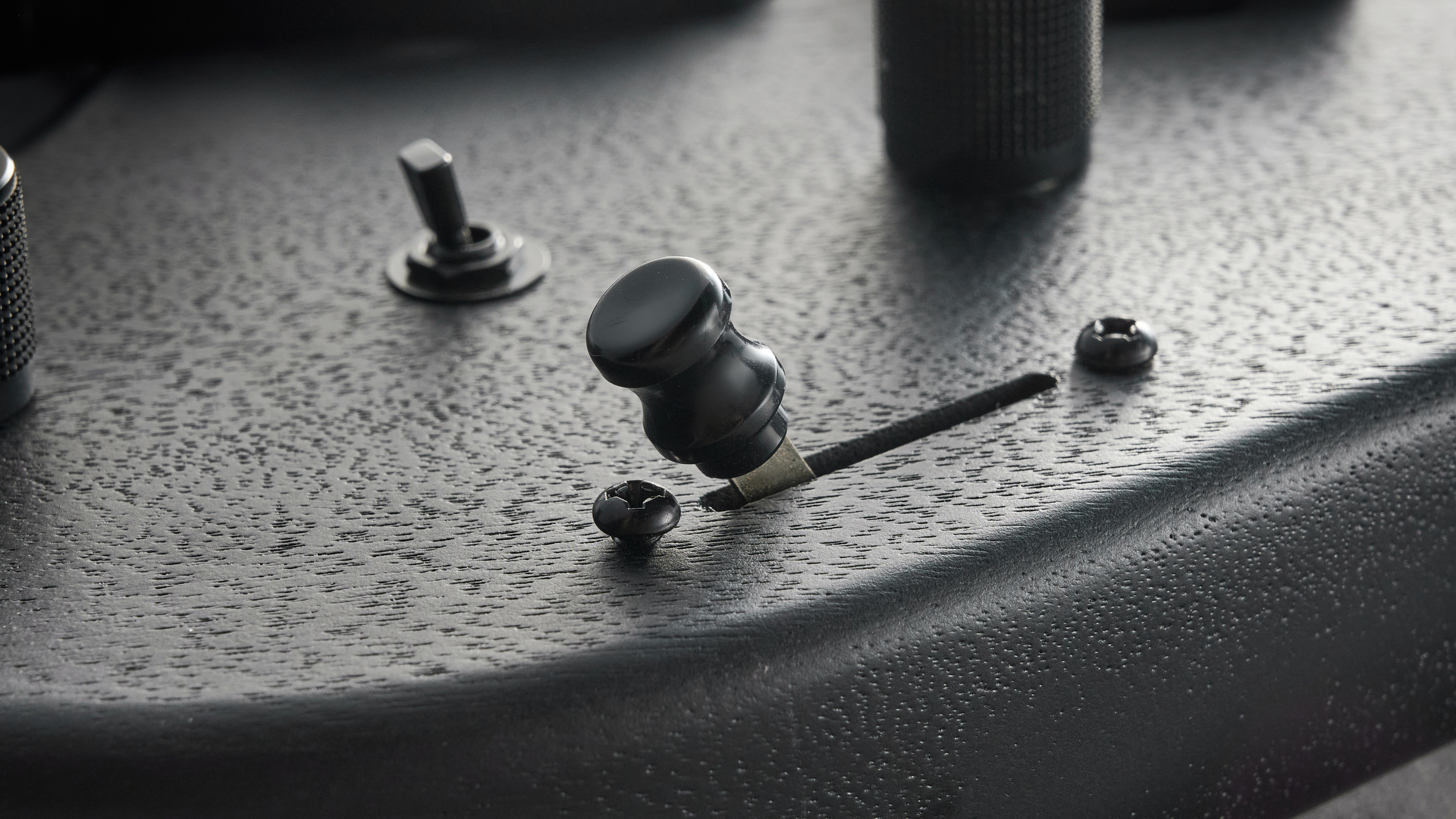 Ibanez QX527B headless guitar shot on grey surface