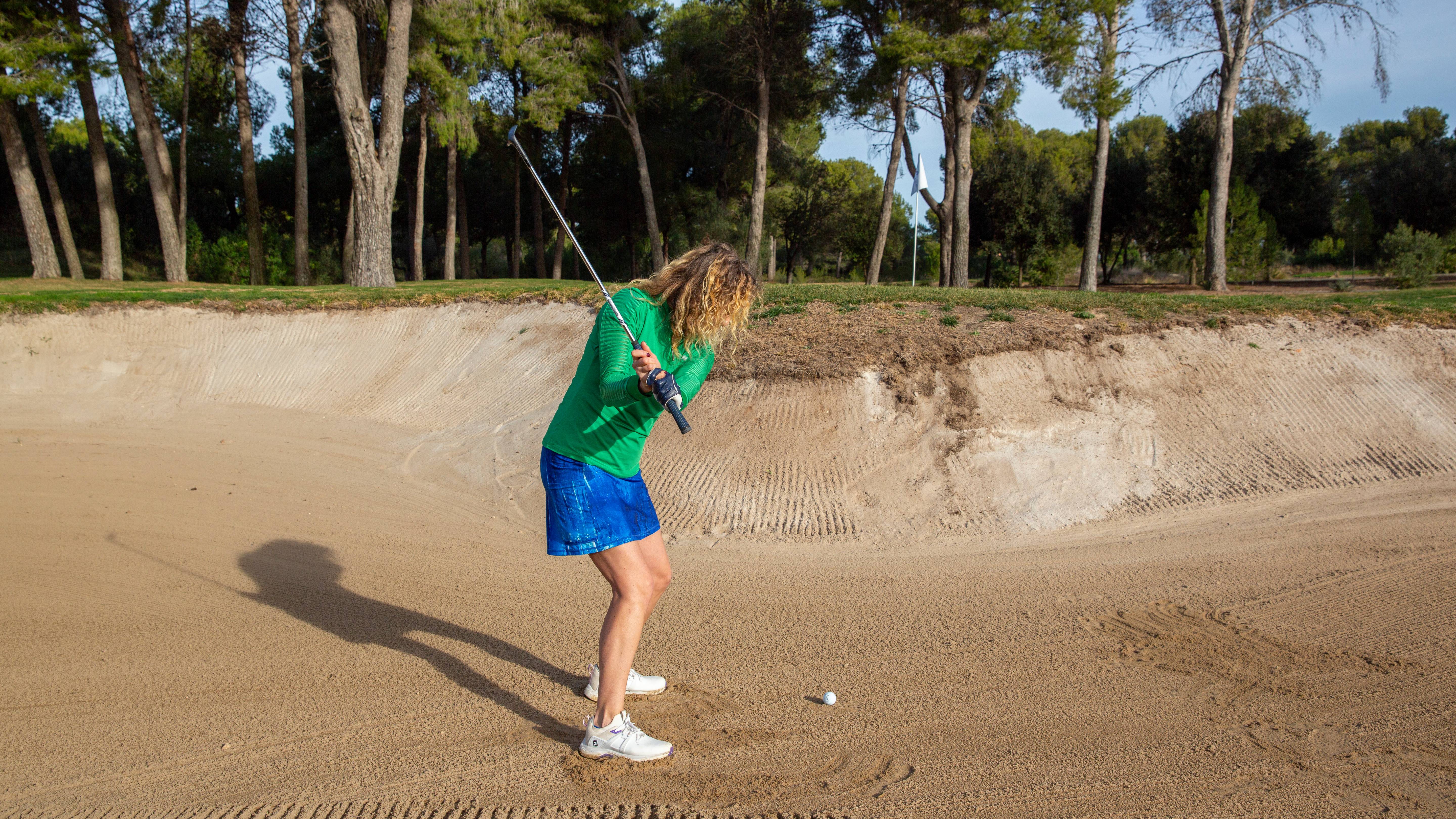 Katie Dawkins demonstrating wrist hinge in the bunker
