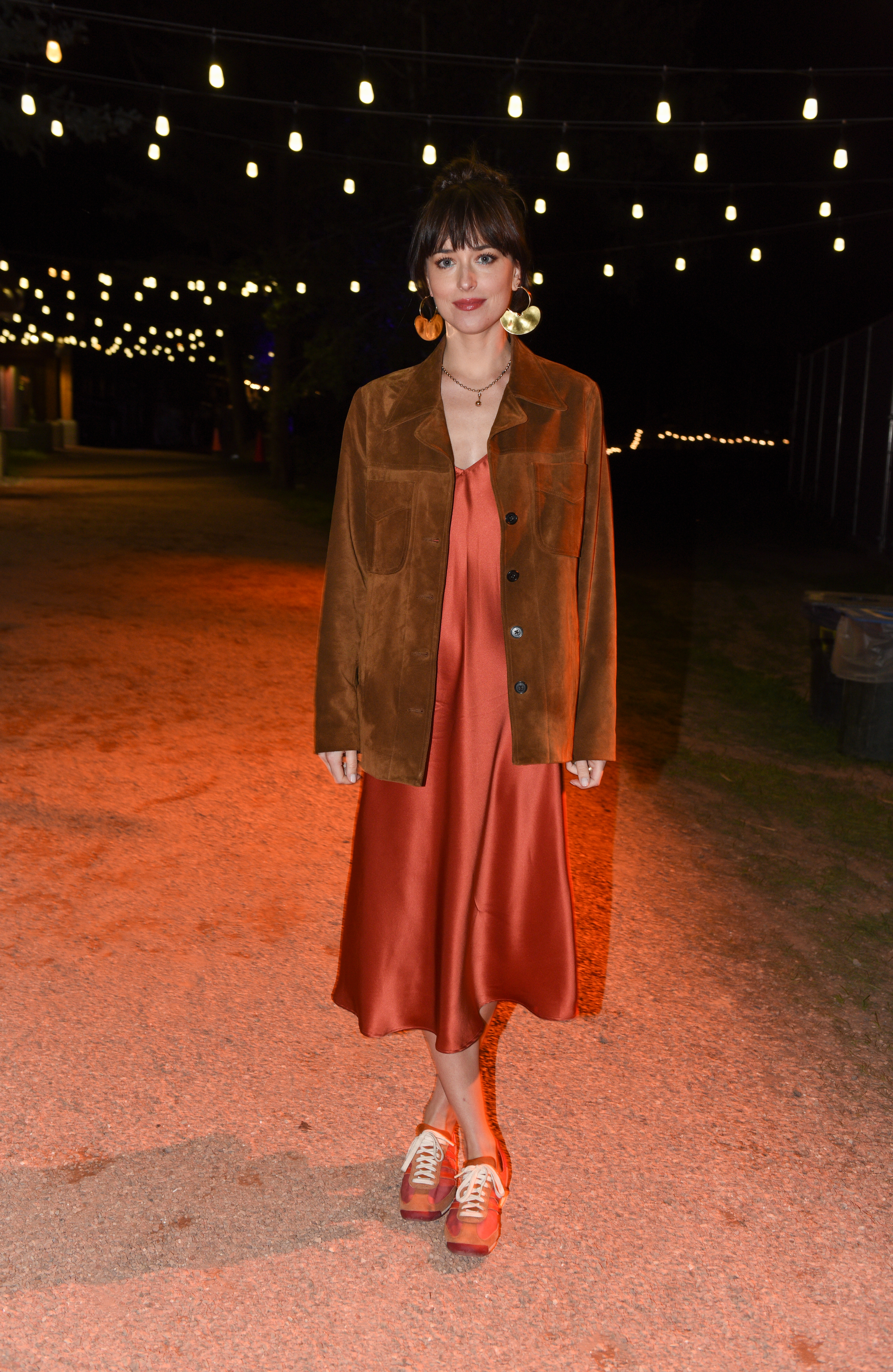 Dakota Johnson wears Adidas x Wales Bonner sneakers at the Telluride Film Festival.