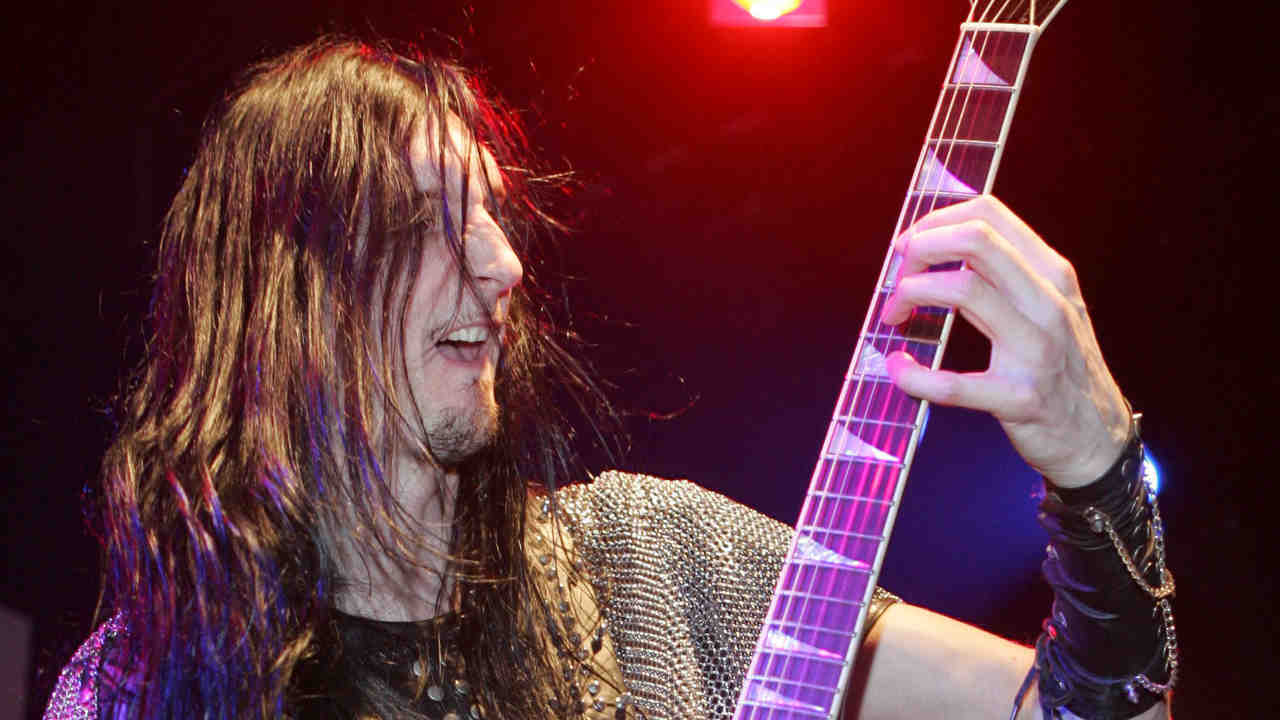 Hammerfall&amp;rsquo;s Oscar Dronjak performing onstage in the 2000s