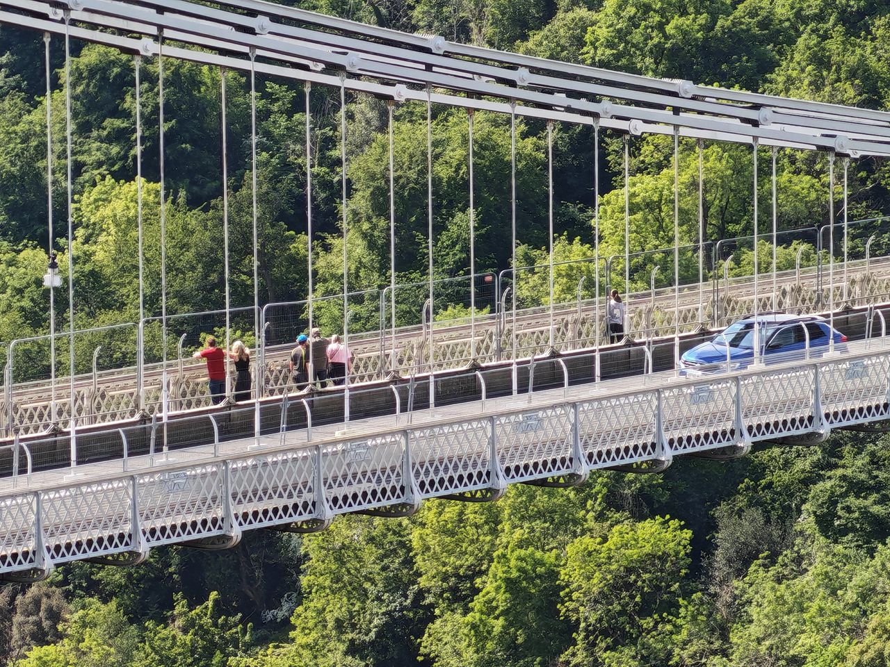 Another zoomed-in shot taken on the Honor 400 Pro showing a suspension bridge with people on it