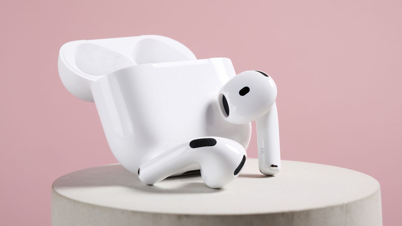 AirPods 4 with Active Noise Cancellation earbuds next to their case