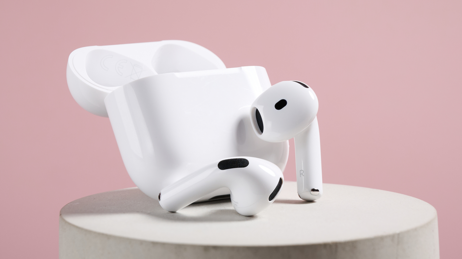 AirPods 4 with Active Noise Cancellation earbuds next to their case