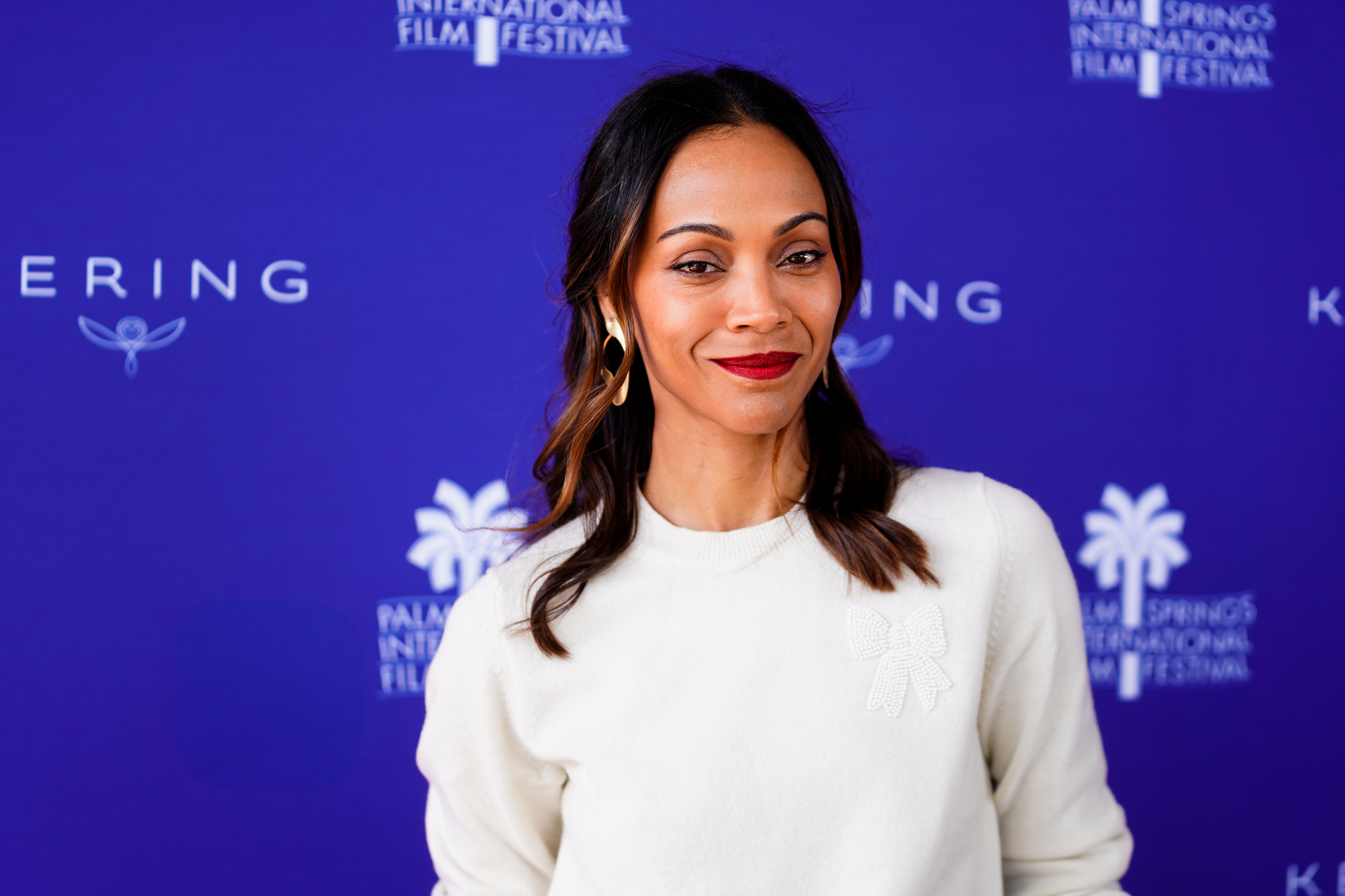 Zoe Salda&amp;ntilde;a attending an event