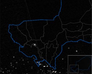 A single satellite image of Niger’s nighttime lights at the beginning of the dry season. Niger’s national borders are outlined in blue (see inset), and the districts are outlined in grey. The bright pixels (shown in white), indicate relatively high population density. The brightest point in Niger is Niamey, the largest city and the capital, shown in the center of this image. During the dry season in Niger, population density increases in the cities.