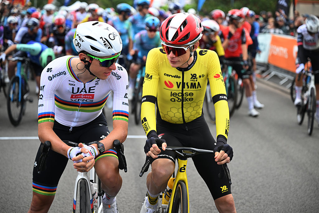 Tadej Pogacar and Jonas Vingegaard chat as they wait for the start of stage 1 of the Criterium du Dauphine