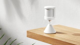 Xiaomi Motion Sensor 2S on wooden shelf