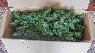 A fake Christmas tree stored in a box