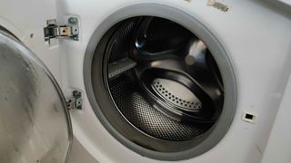 How to sanitize your washer: Image shows the drum of a front load washer.