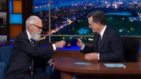 David Letterman and Stephen Colbert clink coffee glasses during the second-to-last week of The Late Show.