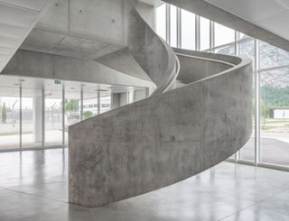 Close up of grey walled spiral staircase