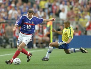 France's Zinedine Zidane is challenged by Brazil's Roberto Carlos in the 1998 World Cup final.