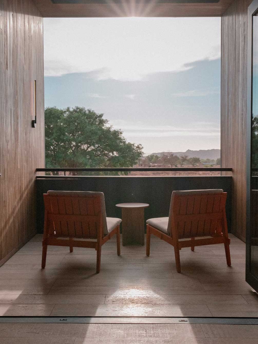 oA chilean luxury hotel features Japandi interiors punctuated by wooden surfaces, earthy tones, and plenty of natural light.