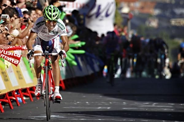 Joaquim Rodriguez (Katusha) crosses the line to take the red jersey.